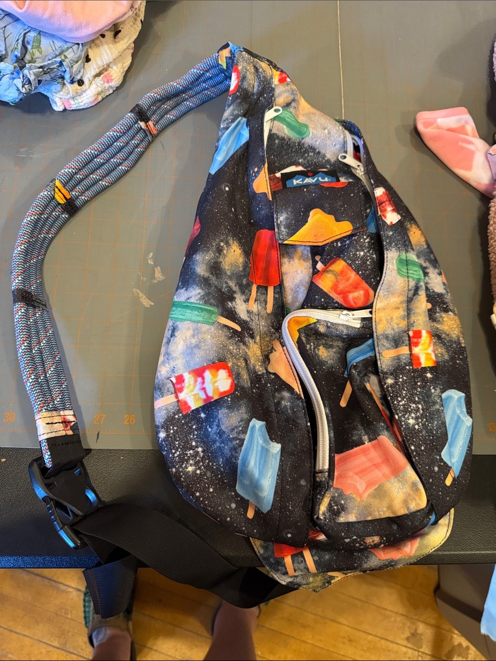 Kavu Popsicle Print Sling Bag - Black with Red, Blue, Green, Yellow Accents